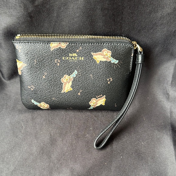 Coach Handbags - Coach Black Wristlet with Musical Penguins